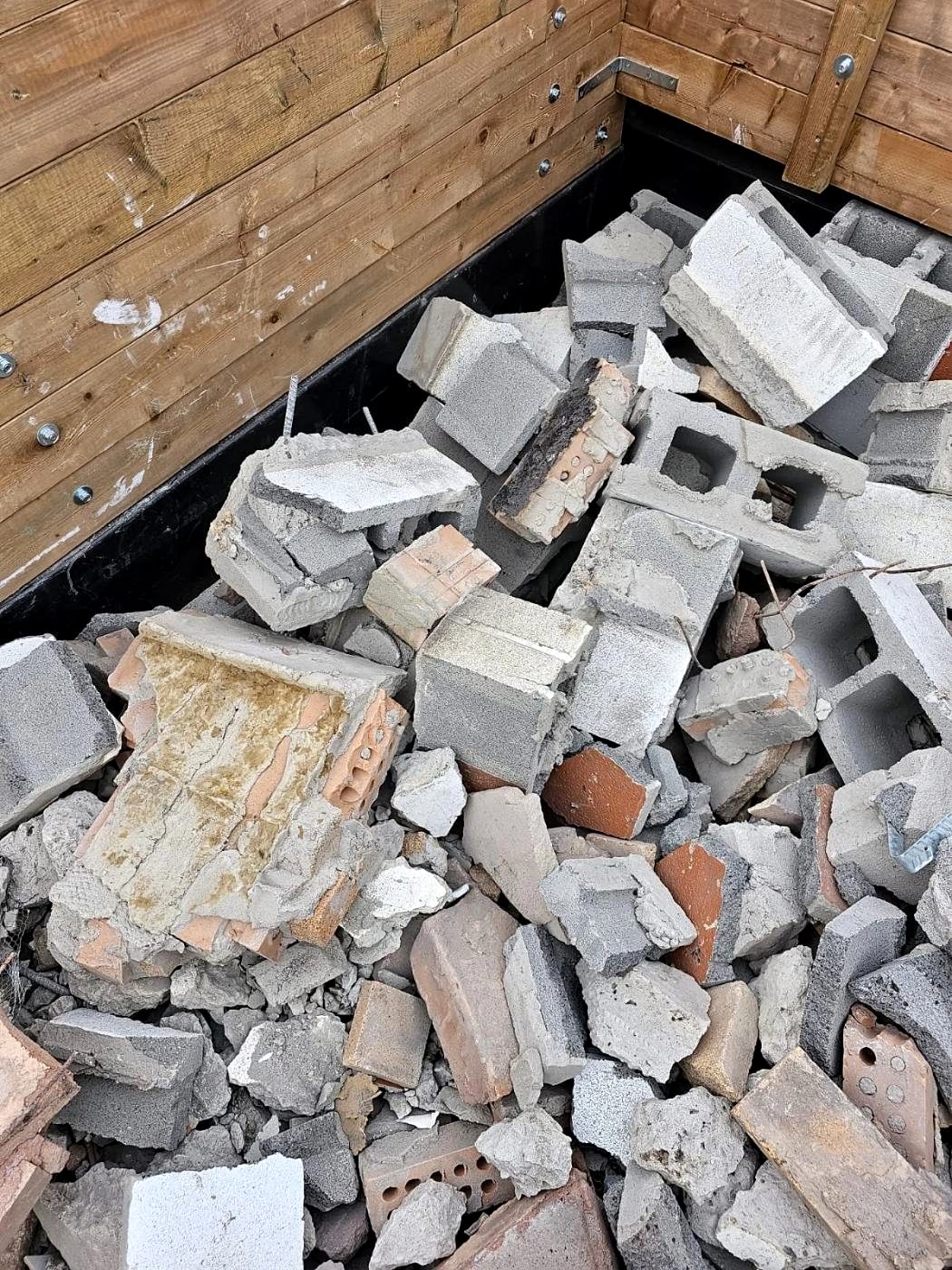 Block and concrete rubble stacked on an industrial demolition site