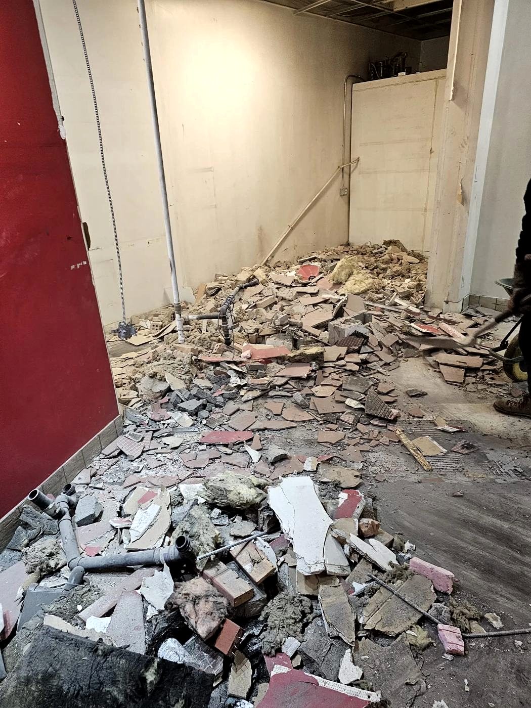 Commercial kitchen stripped back with stainless fixtures removed