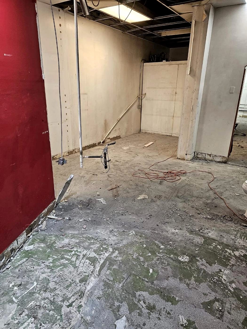 Commercial interior stripped to bare concrete floor