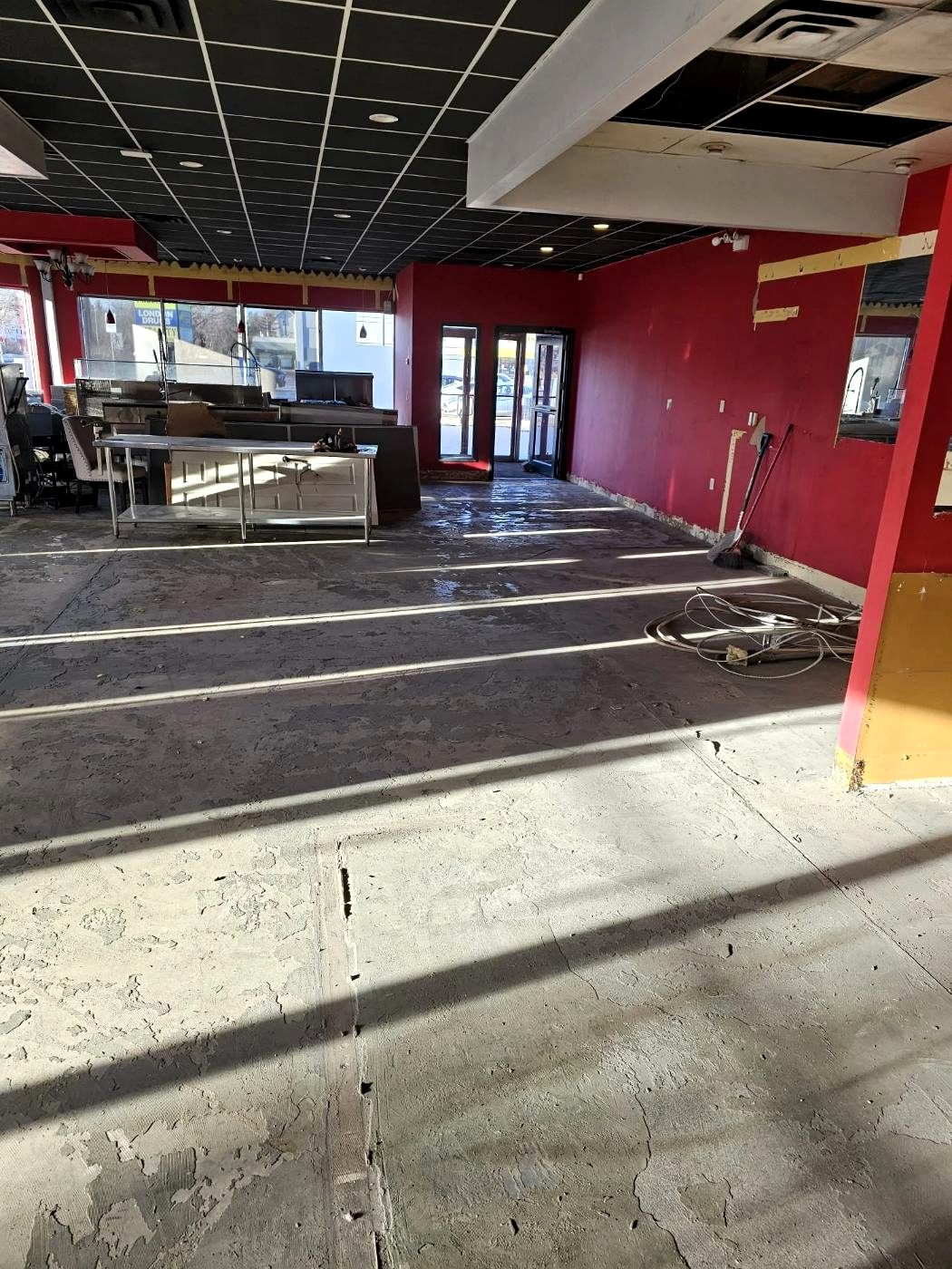 Commercial space stripped back with crew tools on site