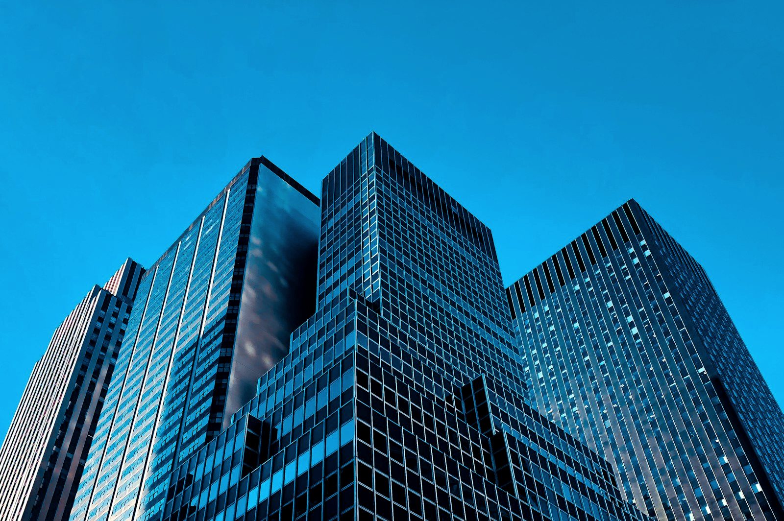 Glass office towers seen from street level